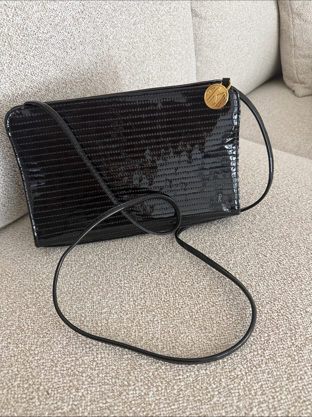 Anne Klein Black Patent Crossbody with Gold Logo Charm